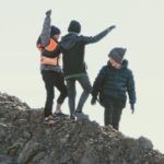 Boys climbed the dirt pile, which to them might as well have been Mount Everest.